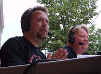 DJs Mark and John review the parade.  Click for a larger picture.