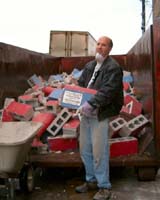 John Ignatowski gleefully removing remains of the wall - what a glamorous job!  Click for a larger picture.